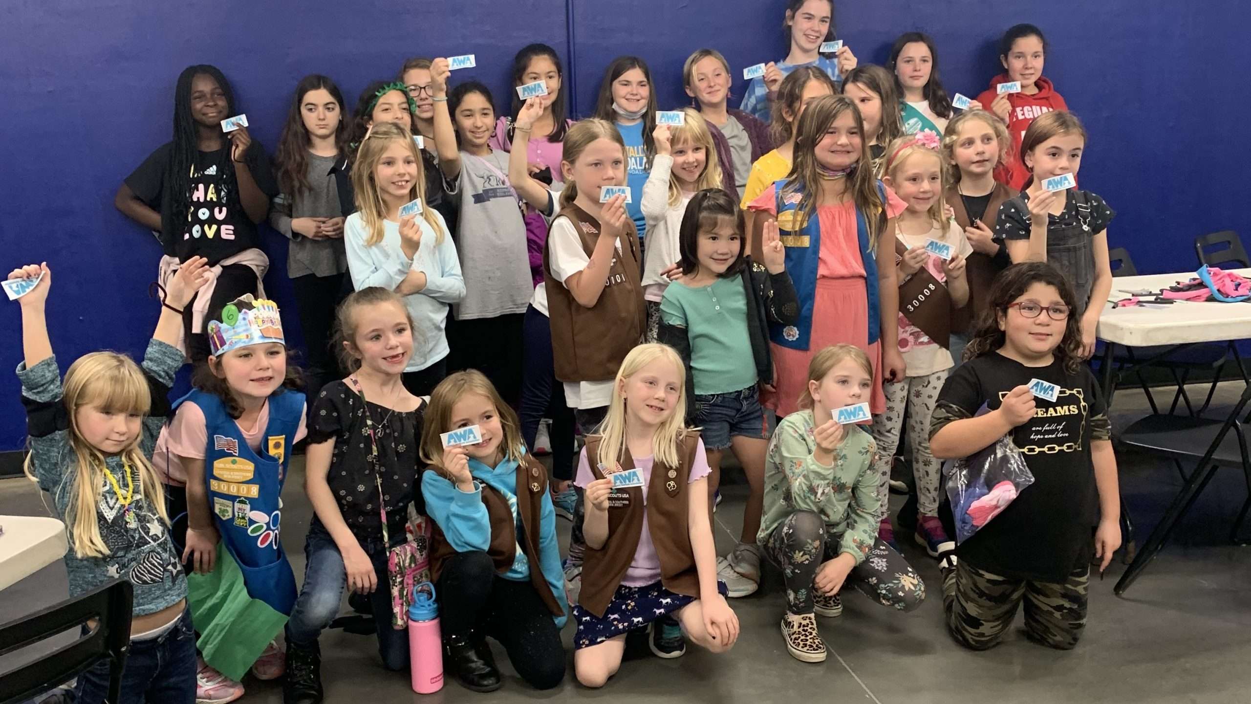 Group of girl scouts earning merit badges for volunteering at Animal Welfare Association in Voorhees