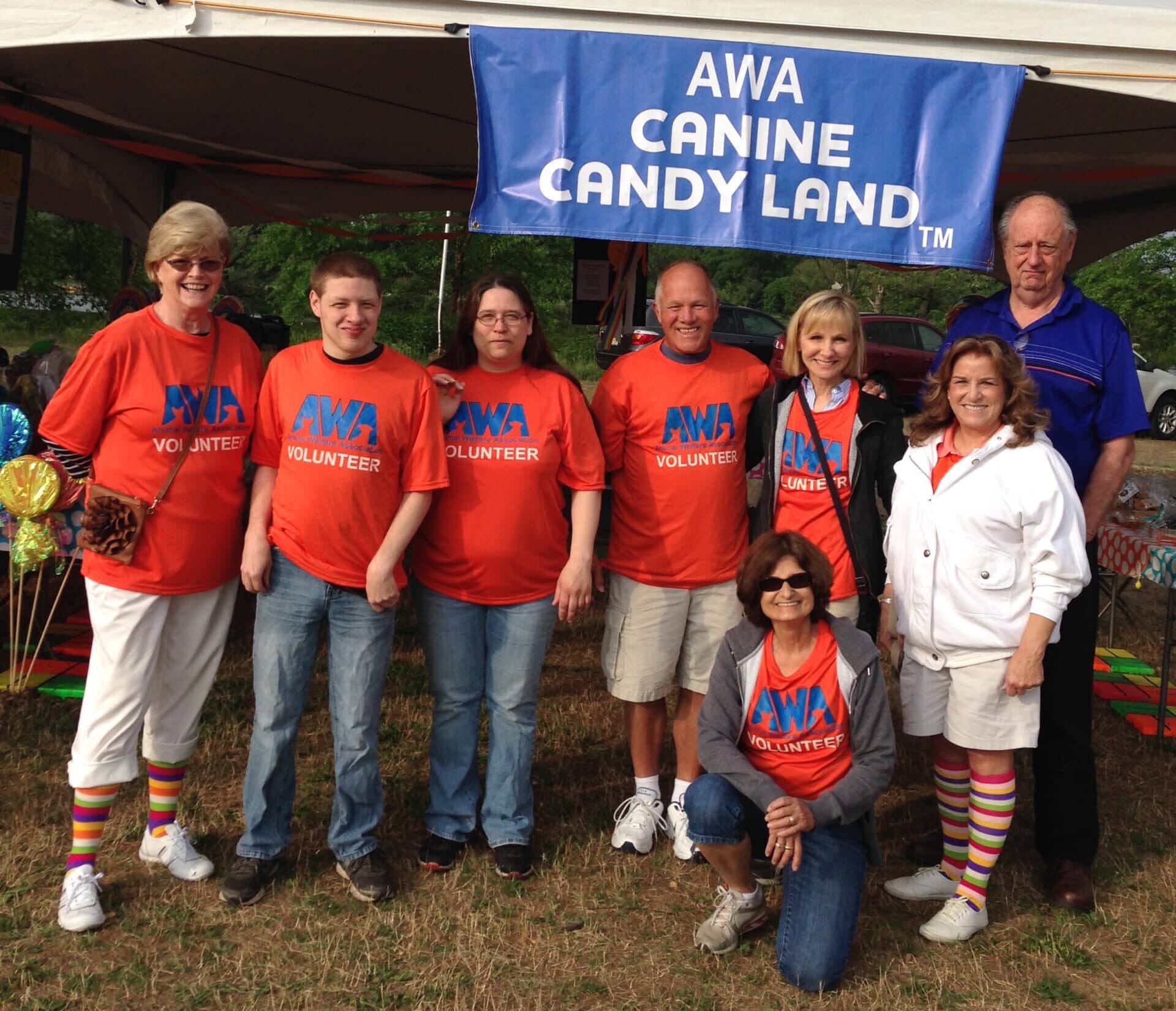 Group of volunteers posing for picture at Animal Welfare Association Paws & Feet.