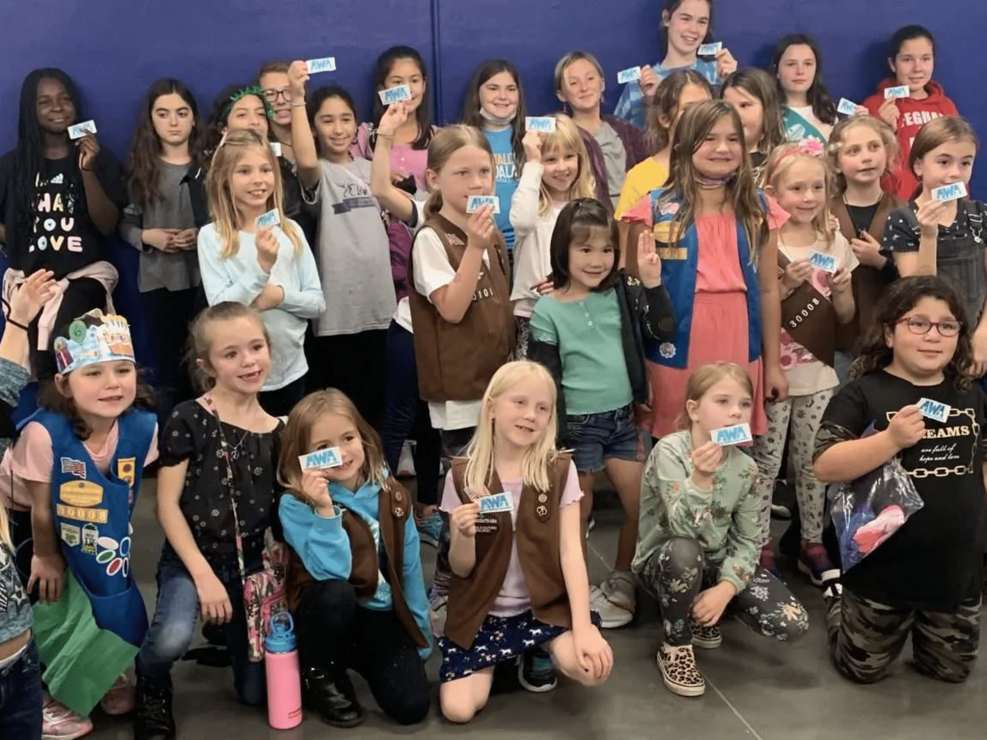 Group of girl scouts earning merit badges for volunteering at Animal Welfare Association in Voorhees
